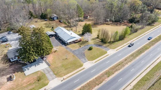 an aerial view of a house with a yard