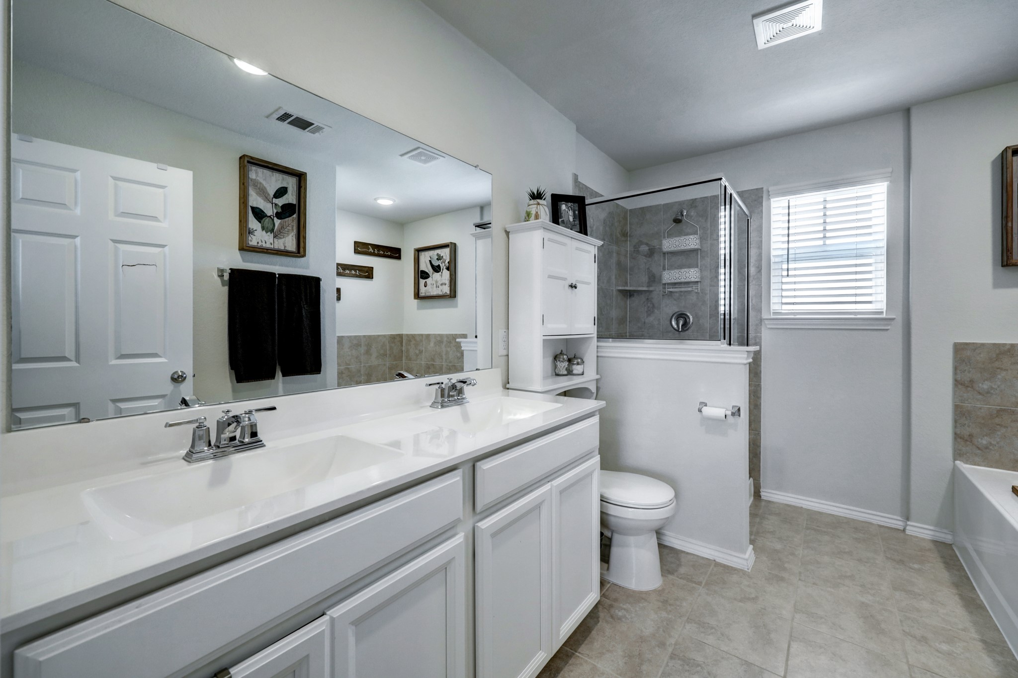 25735 Royal Catchfly Road Katy, TX 77493 - Photo 15 of 31 Primary bath features tile floors, double sinks, soaking tub, and walk in shower.