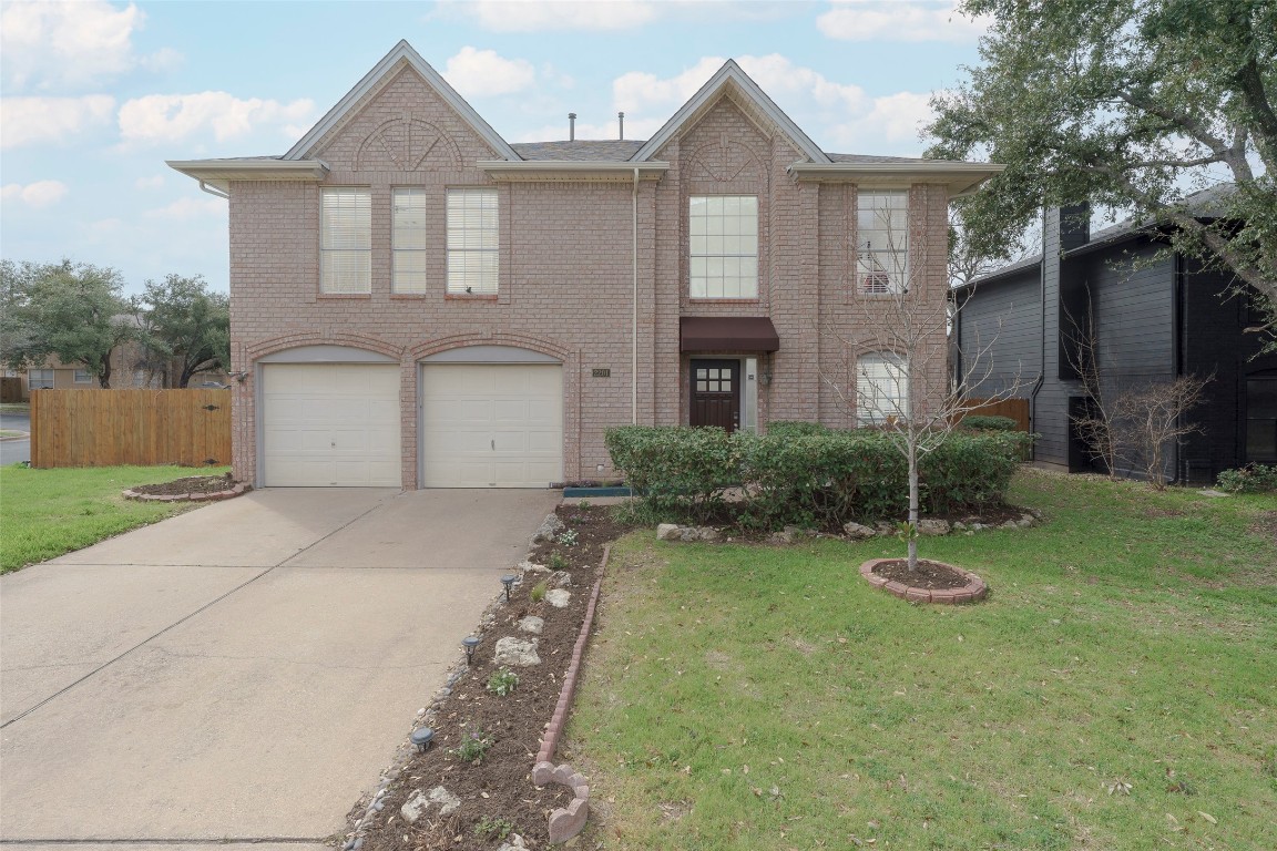 2201 Broughton Court Austin, TX 78727 - Photo 1 of 1 a front view of a house with a yard and garage