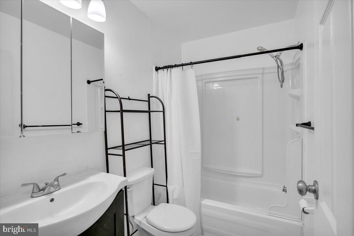 1105 Bromley Estate Pine Hill, NJ 08021 - Photo 14 of 27 a bathroom with a sink toilet and shower