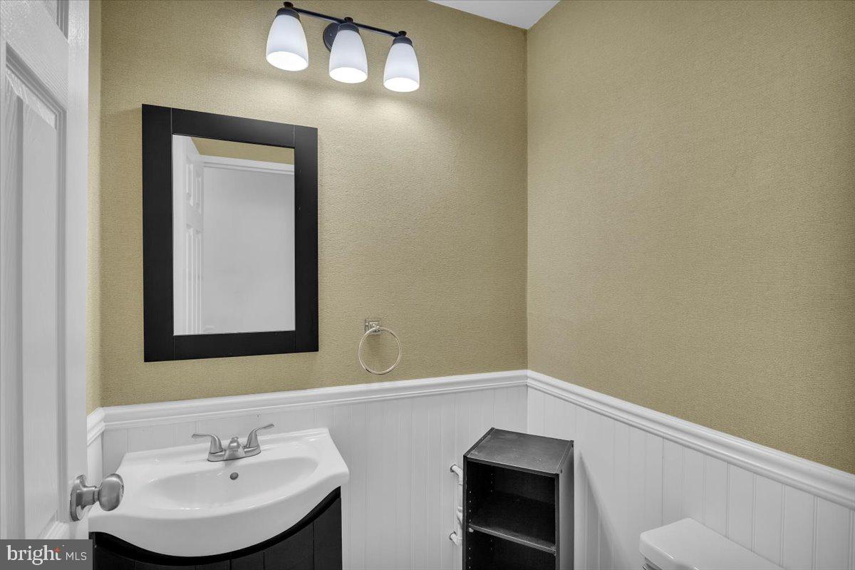 1105 Bromley Estate Pine Hill, NJ 08021 - Photo 15 of 27 a bathroom with a sink a toilet and mirror