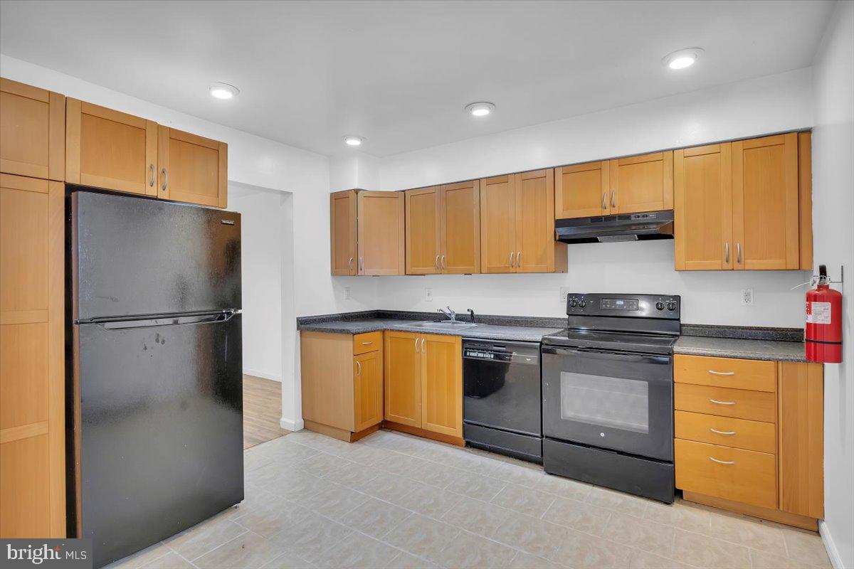 1105 Bromley Estate Pine Hill, NJ 08021 - Photo 2 of 27 a kitchen with stainless steel appliances granite countertop a refrigerator a stove and a sink