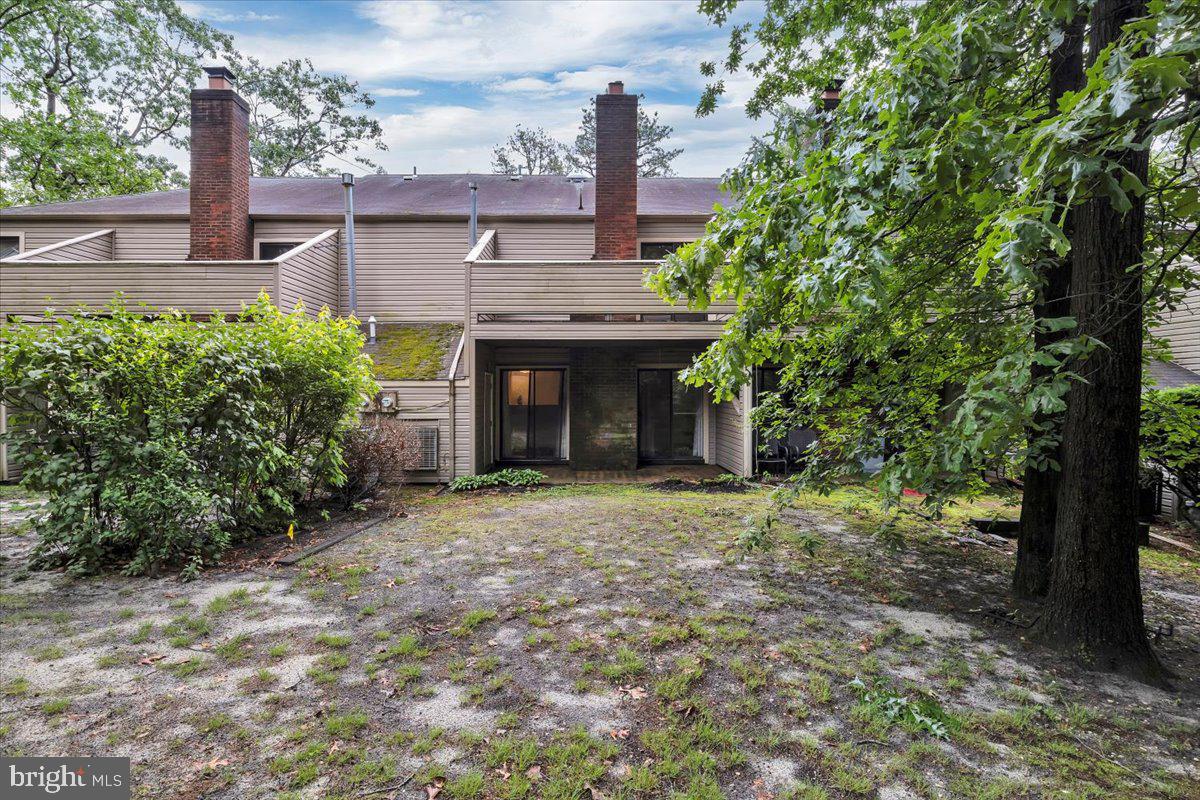 1105 Bromley Estate Pine Hill, NJ 08021 - Photo 24 of 27 a front view of a house with a garden