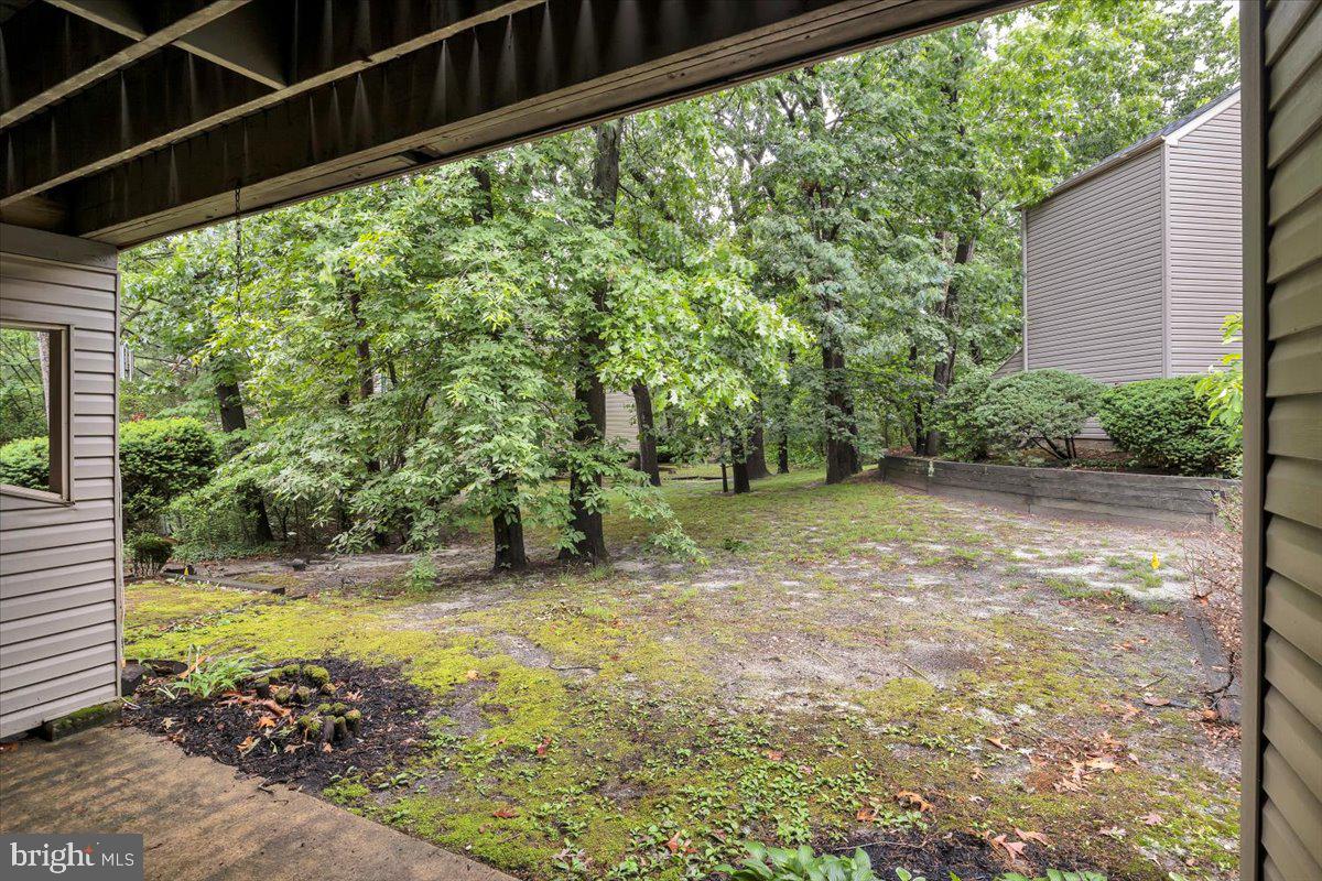1105 Bromley Estate Pine Hill, NJ 08021 - Photo 26 of 27 a view of a garden with a tree