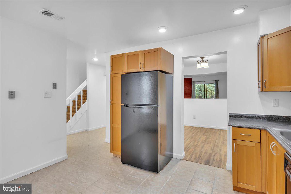 1105 Bromley Estate Pine Hill, NJ 08021 - Photo 4 of 27 a kitchen with stainless steel appliances granite countertop a refrigerator and a sink