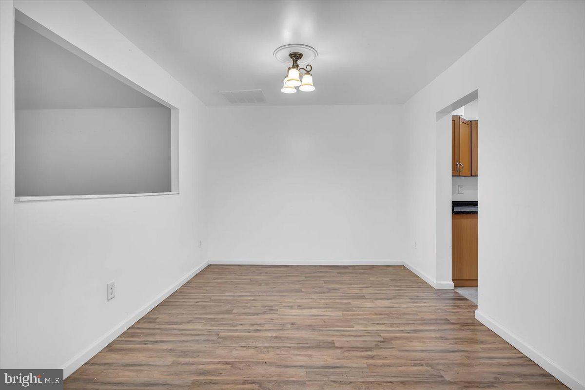 1105 Bromley Estate Pine Hill, NJ 08021 - Photo 8 of 27 a view of empty room with wooden floor