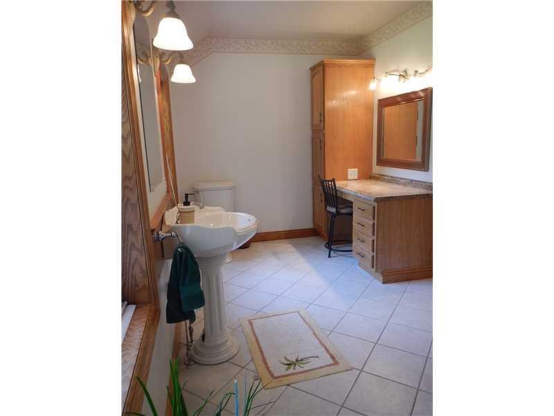 105 Eckstein Road Renfrew, PA 16053 - Photo 20 of 25 Full Bath. Huge full bath on the main floor features a vanity, a pedestal sink, and ceramic tile floor.