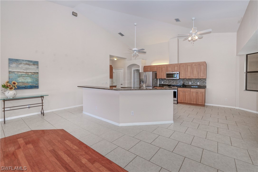 17501 Homewood Road Fort Myers, FL 33967 - Photo 13 of 50 a large kitchen with cabinets and a stove