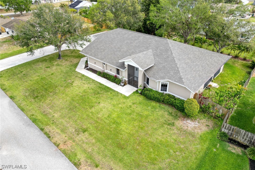 17501 Homewood Road Fort Myers, FL 33967 - Photo 2 of 50 a aerial view of a house next to a big yard and large trees