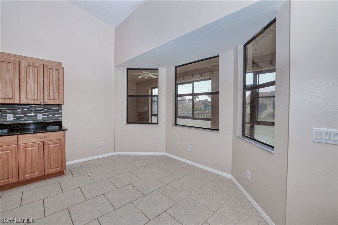 17501 Homewood Road Fort Myers, FL 33967 - Photo 21 of 50 a view of an empty room with window and cabinet