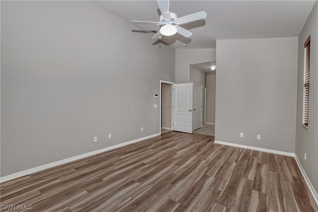 17501 Homewood Road Fort Myers, FL 33967 - Photo 36 of 50 wooden floor in an empty room with a fan