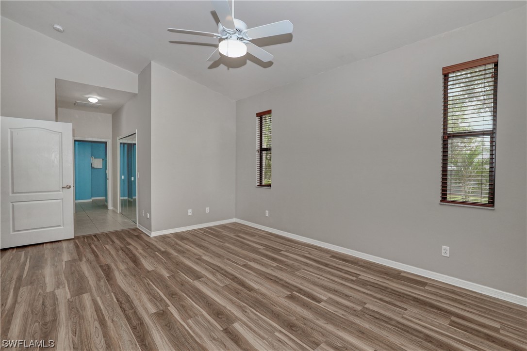 17501 Homewood Road Fort Myers, FL 33967 - Photo 37 of 50 wooden floor in an empty room with a window