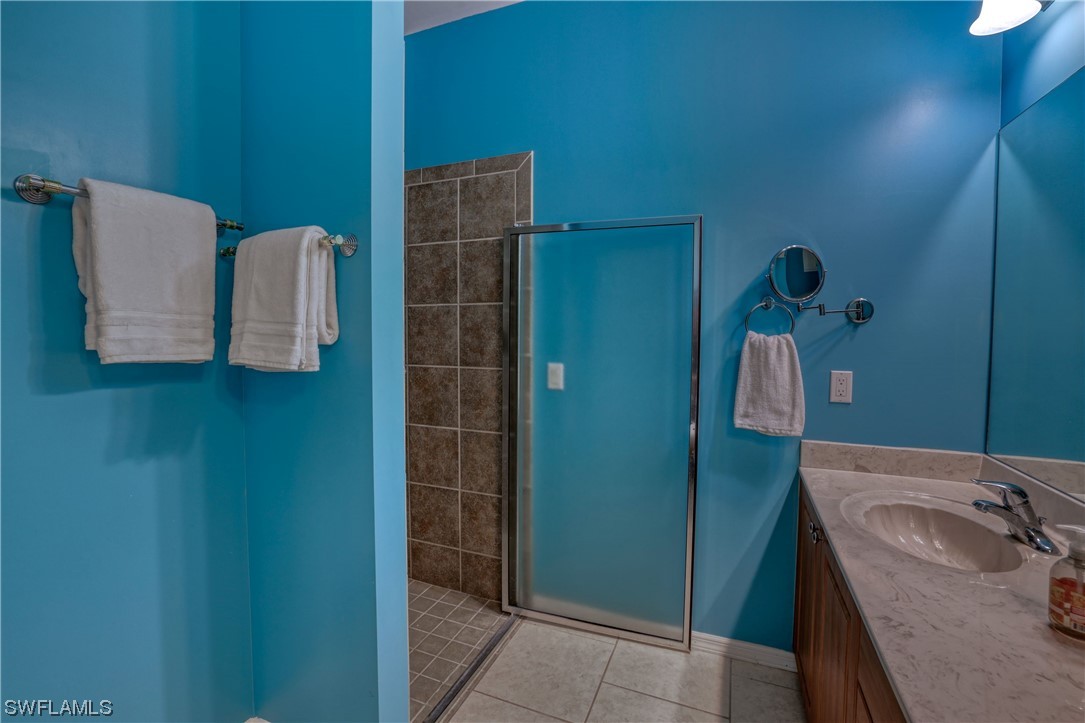 17501 Homewood Road Fort Myers, FL 33967 - Photo 40 of 50 a bathroom with a sink and mirror