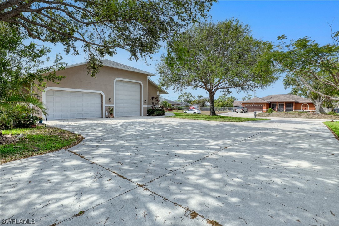 17501 Homewood Road Fort Myers, FL 33967 - Photo 4 of 50 a front view of a house with a yard
