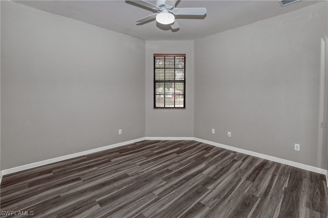 17501 Homewood Road Fort Myers, FL 33967 - Photo 44 of 50 wooden floor in an empty room with a window