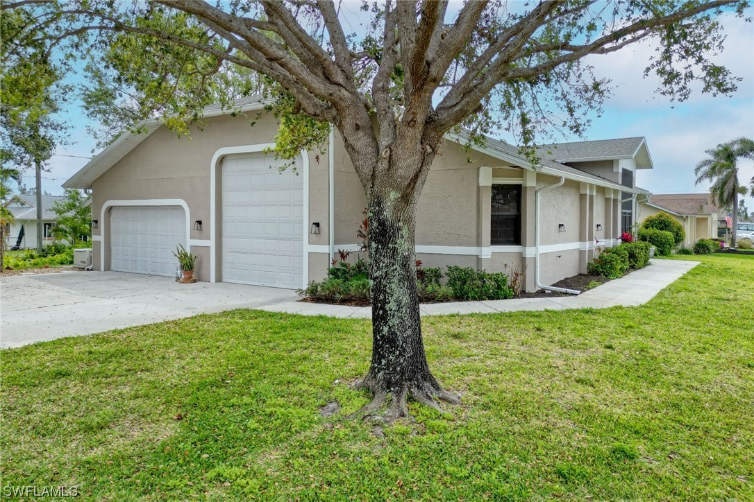 17501 Homewood Road Fort Myers, FL 33967 - Photo 49 of 50 a front view of house with yard and green space