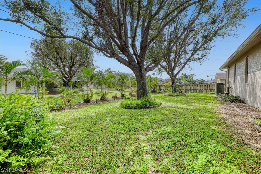 17501 Homewood Road Fort Myers, FL 33967 - Photo 5 of 50 a view of a yard with plants and large trees