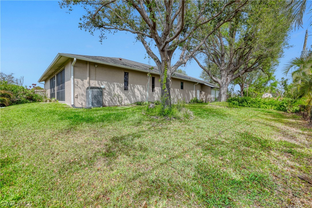 17501 Homewood Road Fort Myers, FL 33967 - Photo 6 of 50 a house with a tree in front of it