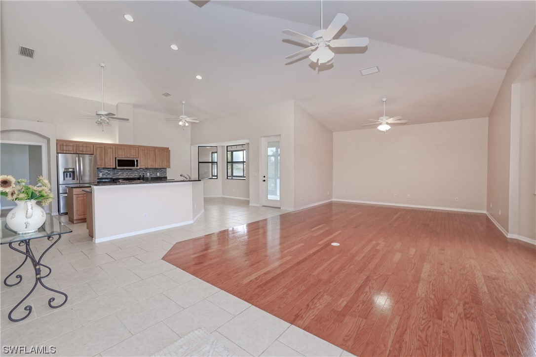 17501 Homewood Road Fort Myers, FL 33967 - Photo 8 of 50 a view of a kitchen with furniture and a ceiling fan