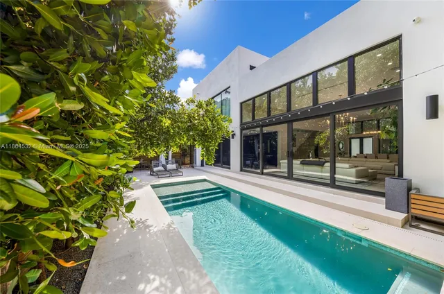 a view of swimming pool with an outdoor seating