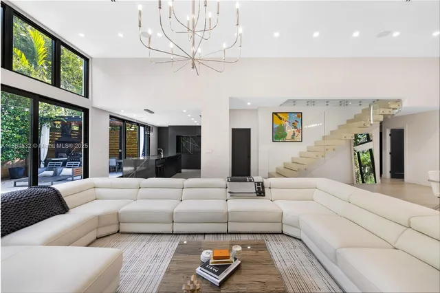 a spacious bedroom with a bed and a window