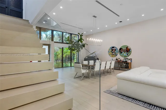 a bathroom with a double vanity sink a mirror and a bathtub