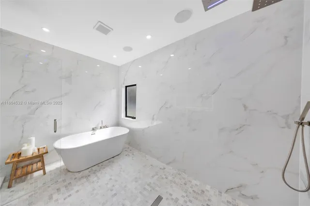 a bathroom with a bathtub and a sink