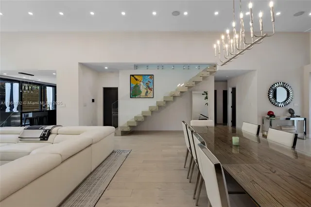a kitchen with stainless steel appliances granite countertop a sink and a microwave