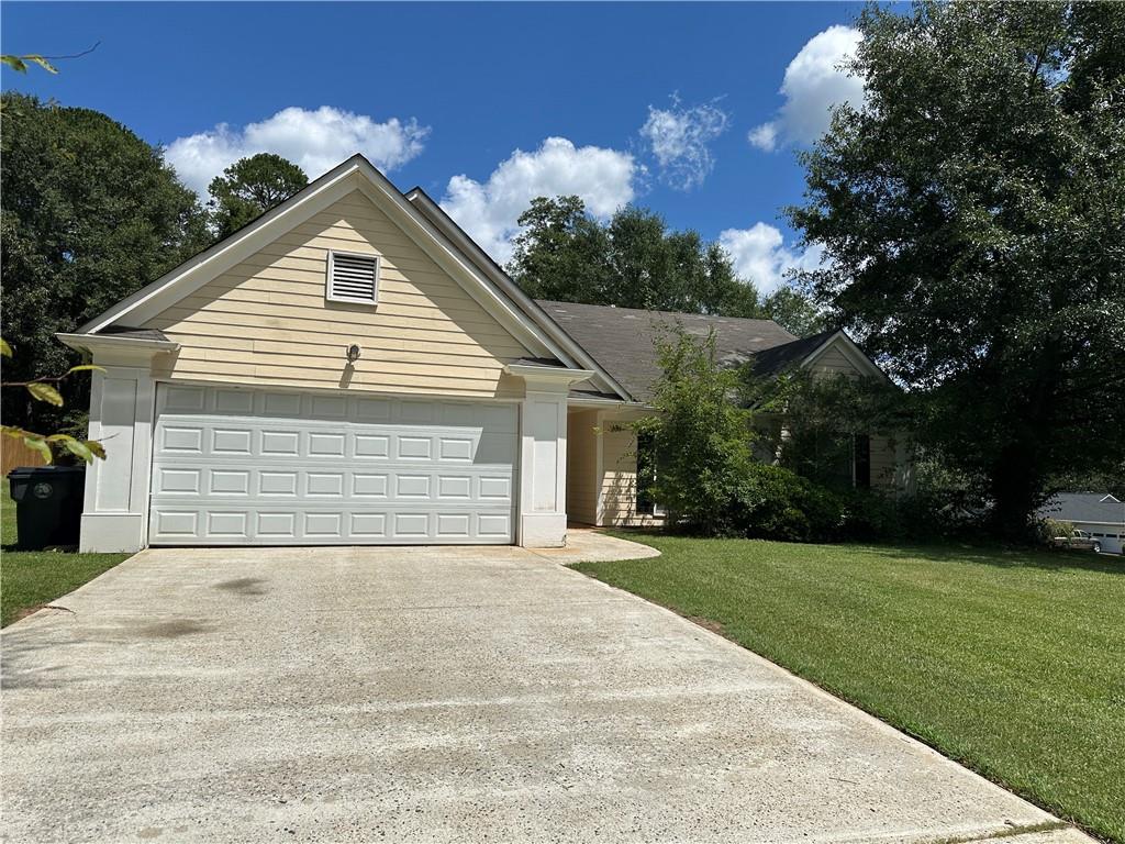 500 Dacula Ridge Court Dacula, GA 30019 - Photo 1 of 1 a view of a house with a yard and garage