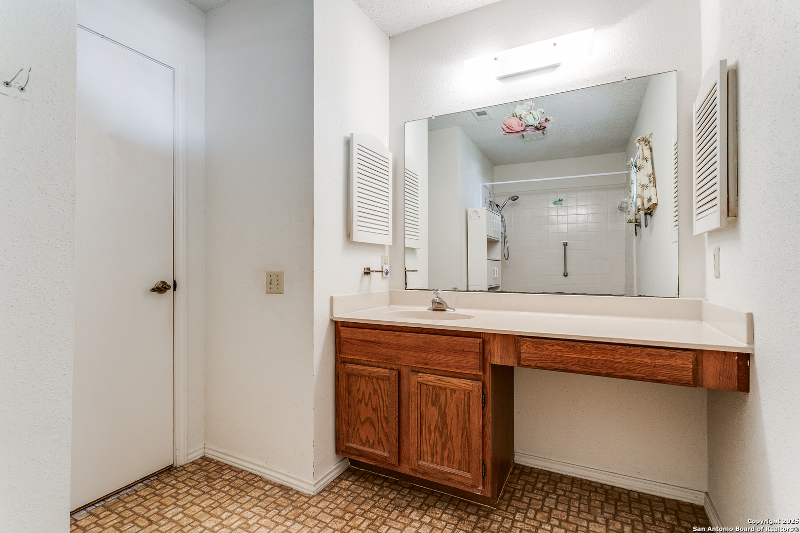 3629 Fox Run Schertz, TX 78108 - Photo 17 of 25 a spacious bathroom with a sink a mirror and a shower