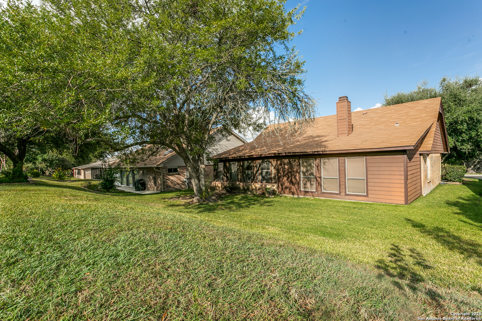 3629 Fox Run Schertz, TX 78108 - Photo 24 of 25 a view of a house with a yard and sitting area