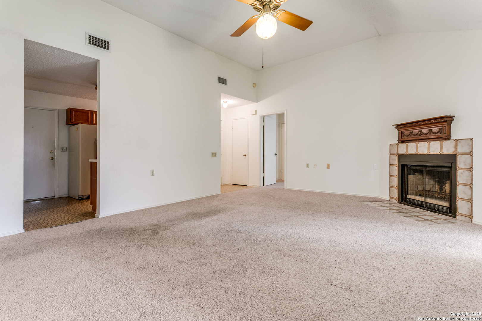 3629 Fox Run Schertz, TX 78108 - Photo 6 of 25 a view of an empty room with a fireplace