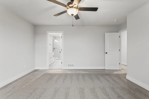 a bathroom with a double vanity sink toilet mirror and shower