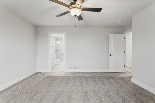 a bathroom with a double vanity sink toilet mirror and shower