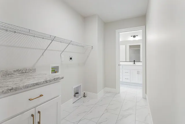 a spacious bathroom with a granite countertop sink and a mirror
