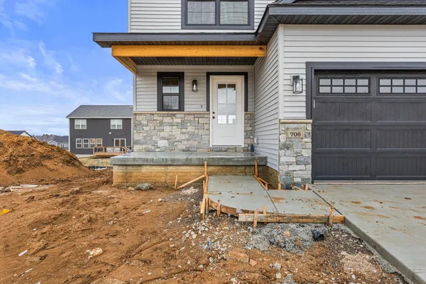 a front view of a house with swimming pool