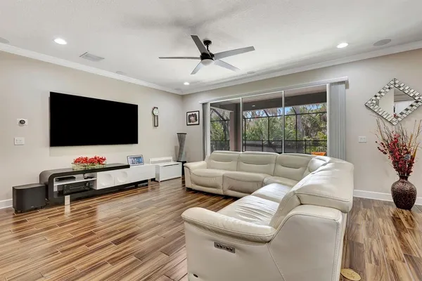 a spacious bedroom with a bed and a dresser