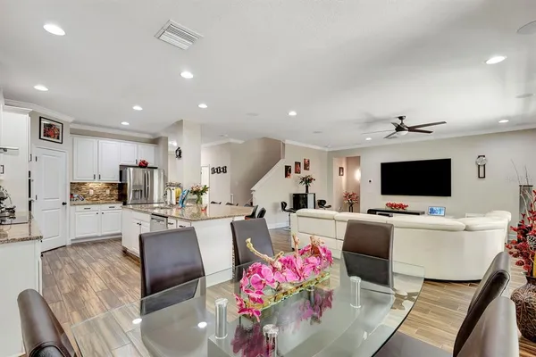 a view of a livingroom with furniture and hardwood floor