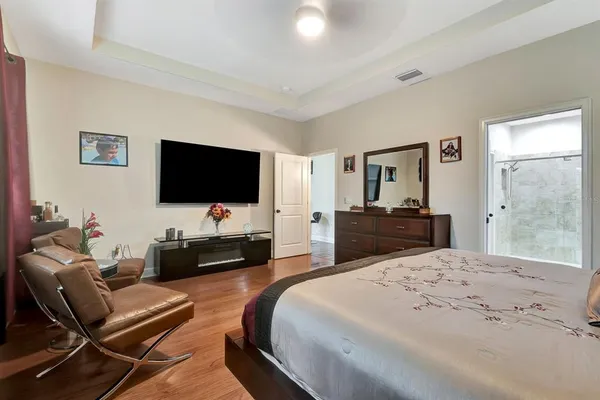 a bedroom with a bed and a dresser