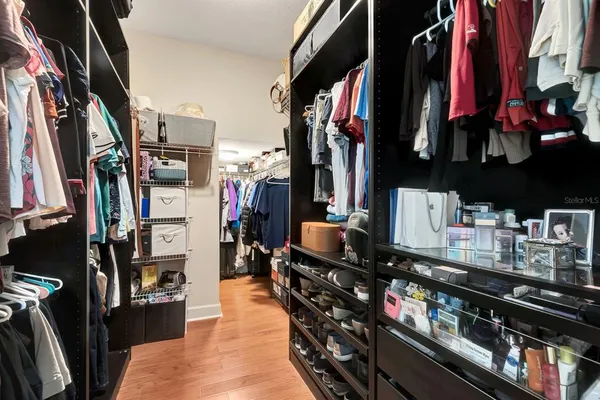 a spacious bedroom with a bed and a couch