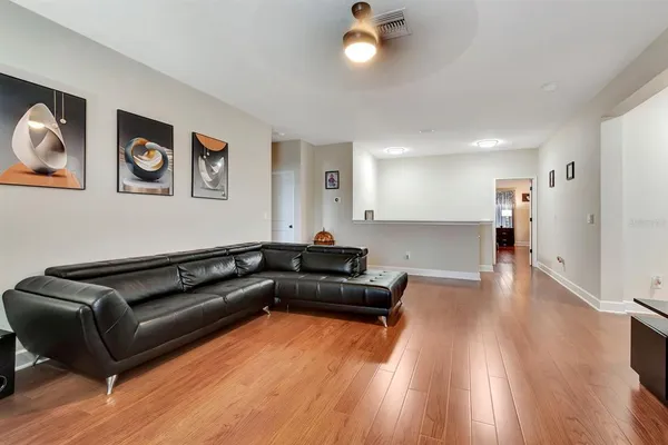 a spacious bedroom with a bed and a couch