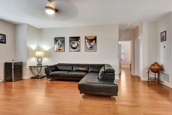 a bathroom with a granite countertop sink mirror vanity and toilet