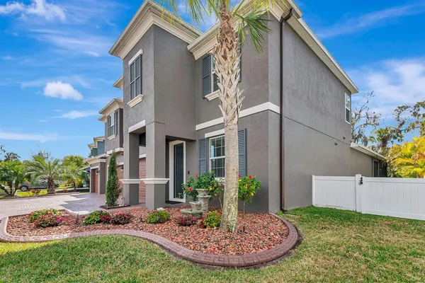 a view of a hallway with wooden floor and furniture