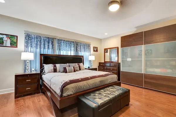 an aerial view of residential houses with outdoor space and swimming pool