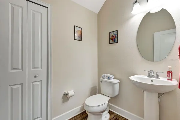 a kitchen with a refrigerator and a stove top oven