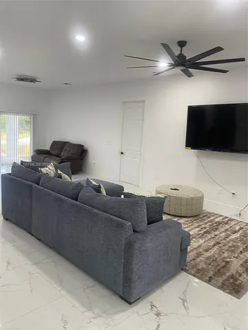 a kitchen with kitchen island cabinets and oven