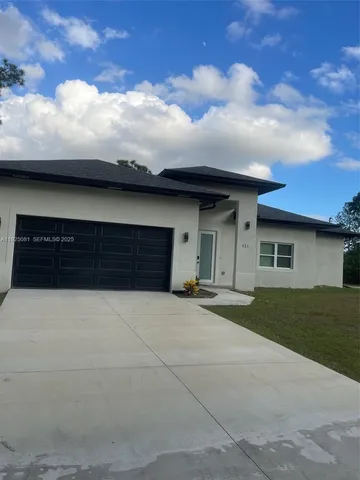 a house view with a garden space