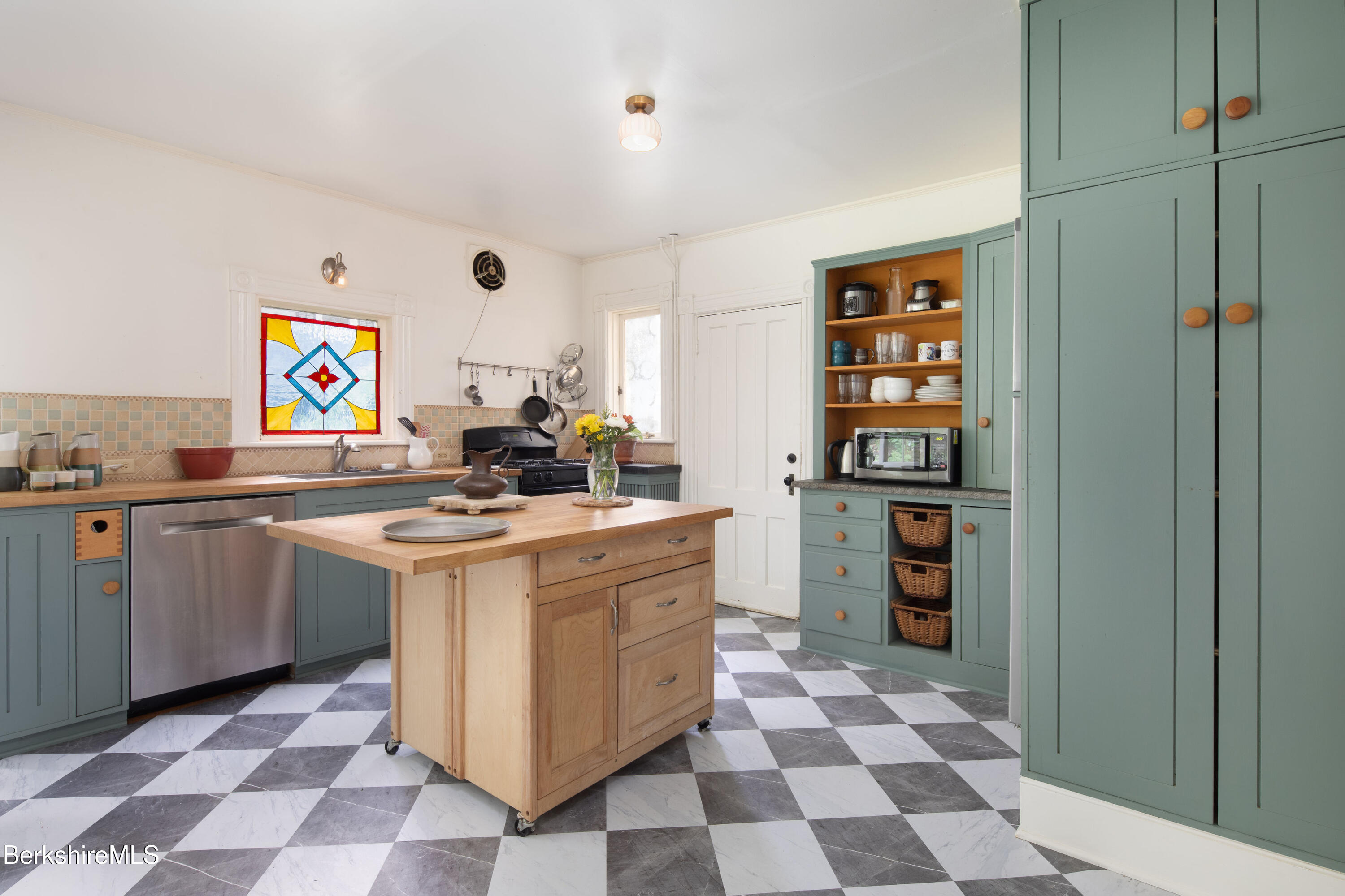 77 Grove Street Great Barrington, MA 01230 - Photo 12 of 31 a kitchen with stainless steel appliances granite countertop a stove and a cabinets