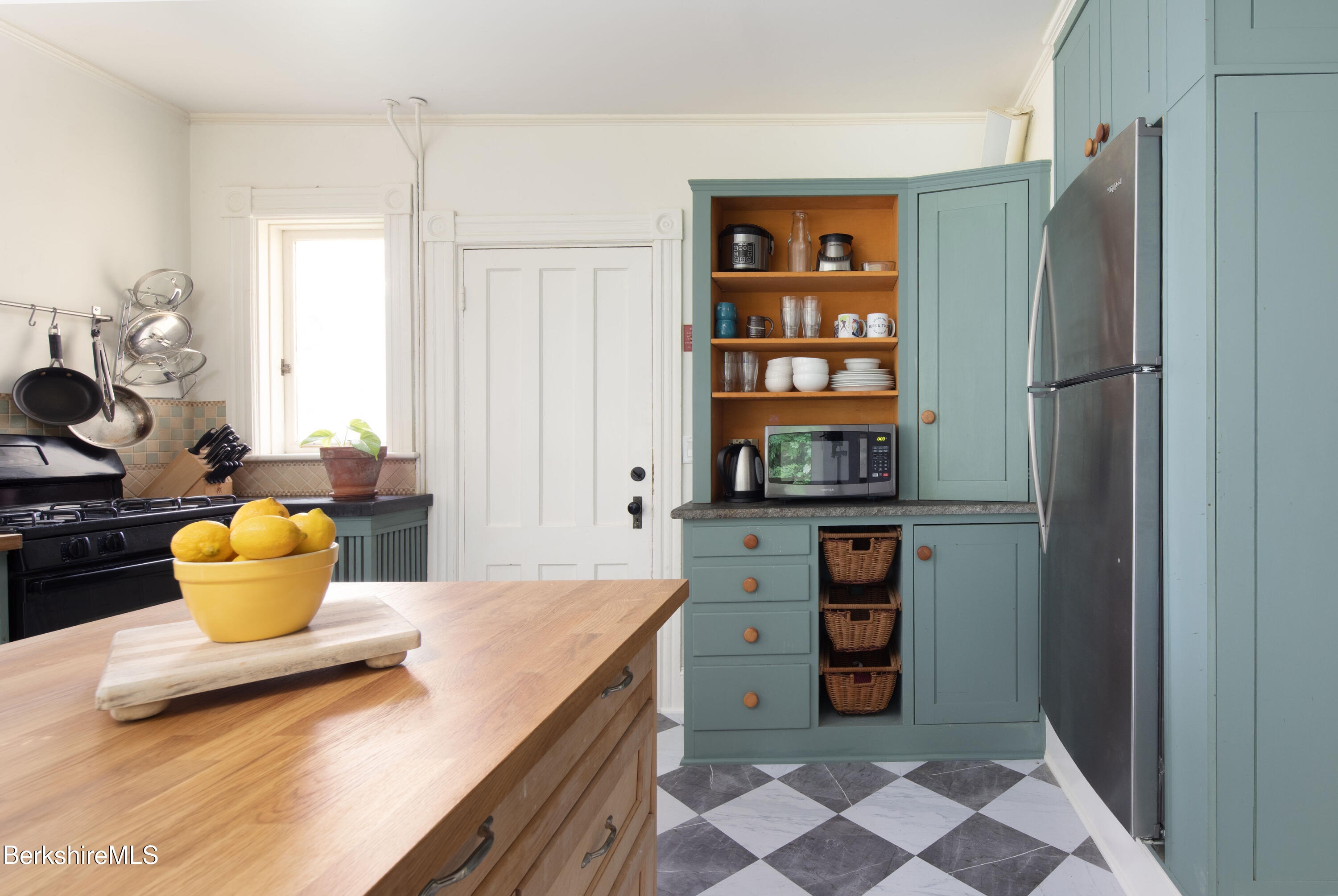 77 Grove Street Great Barrington, MA 01230 - Photo 14 of 31 a kitchen with a refrigerator and a more cabinets
