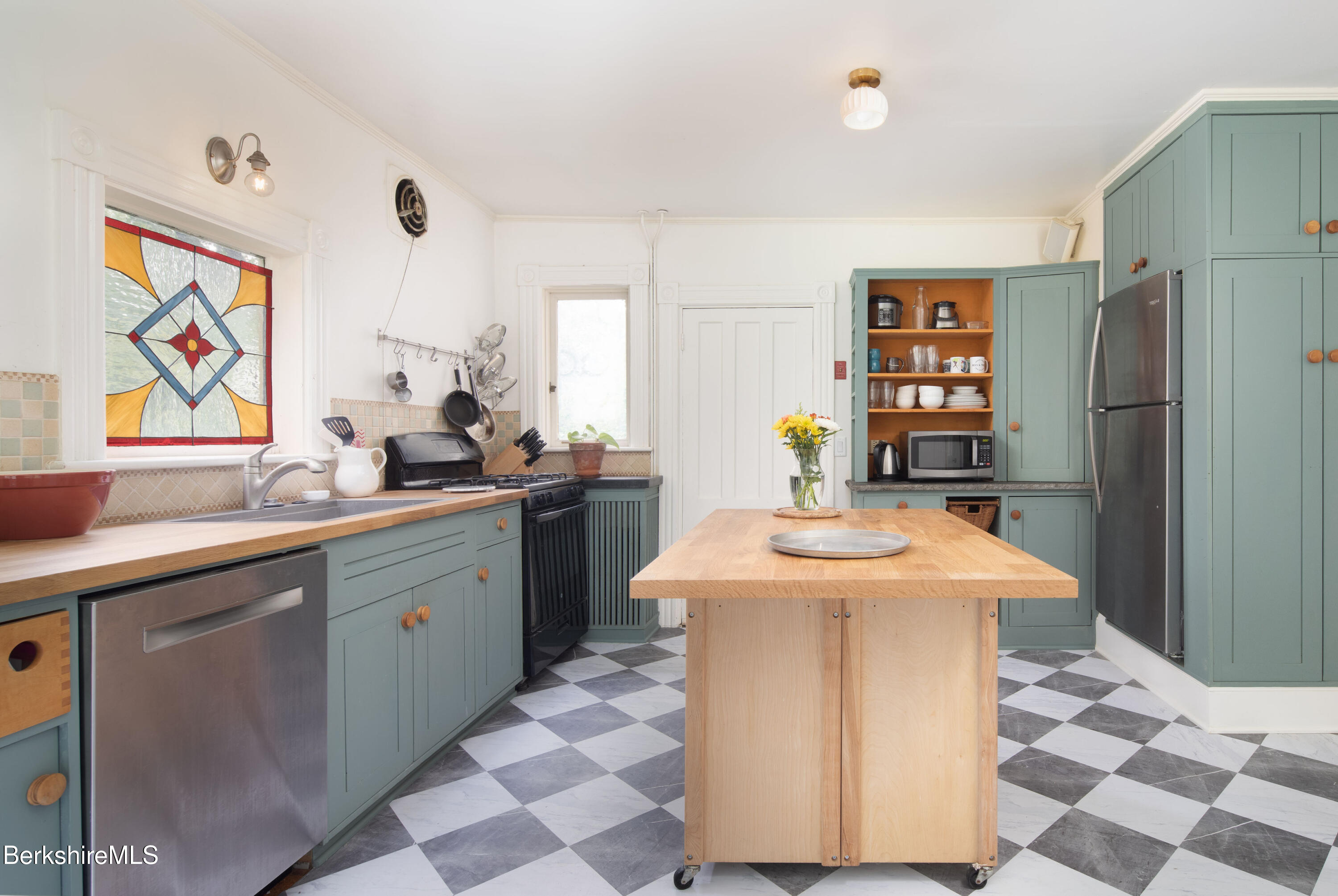 77 Grove Street Great Barrington, MA 01230 - Photo 15 of 31 a kitchen with stainless steel appliances a sink and a refrigerator